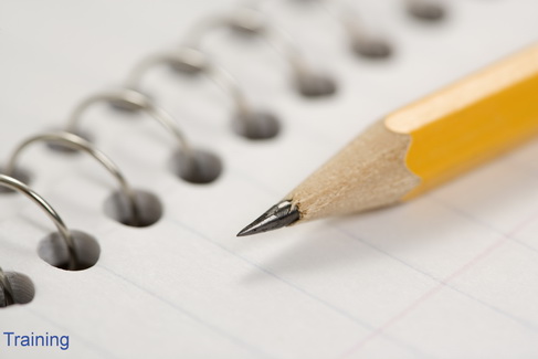 Close up of pencil on top of spiral bound notebook.